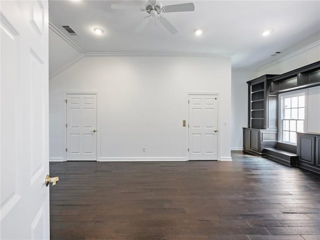 unfurnished living room with crown molding, lofted ceiling, dark wood-type flooring, and ceiling fan