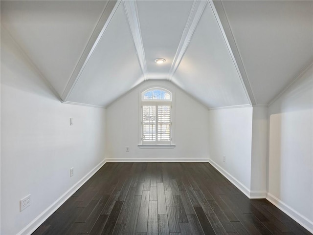 bonus room with dark wood-type flooring and lofted ceiling