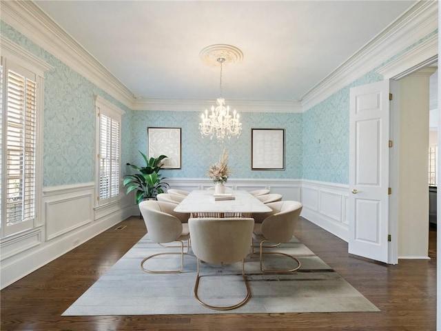 dining space featuring dark wood-type flooring and a wealth of natural light