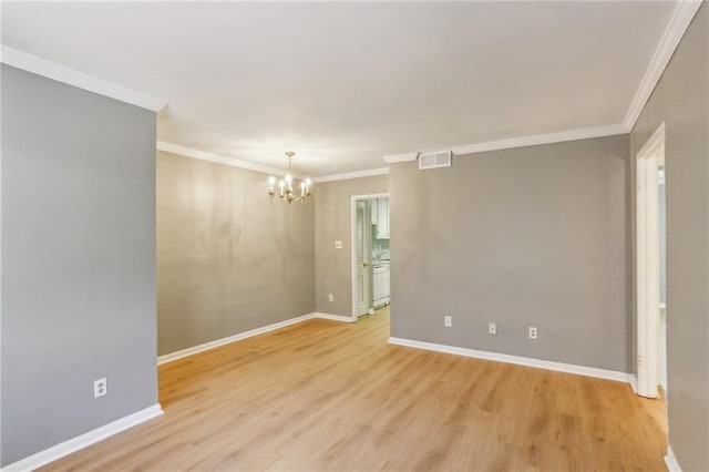 91 Rumson Rd NE Unit B25, Atlanta, GA 30305 - unfurnished room featuring a chandelier, light wood-type flooring, baseboards, and ornamental molding