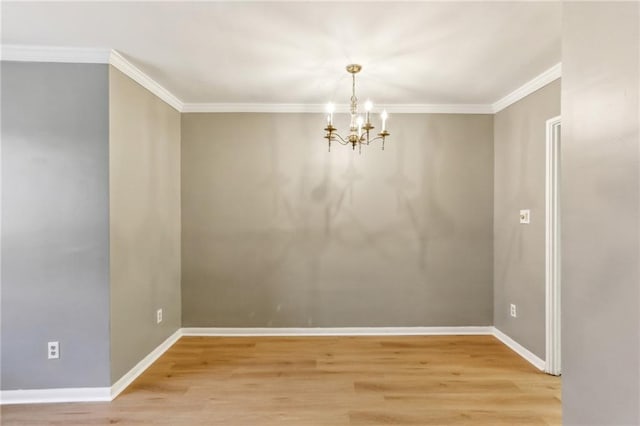 91 Rumson Rd NE Unit B25, Atlanta, GA 30305 - empty room with a chandelier, light wood finished floors, crown molding, and baseboards
