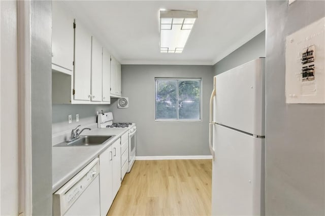 91 Rumson Rd NE Unit B25, Atlanta, GA 30305 - kitchen featuring white appliances, light countertops, light wood-type flooring, white cabinets, and a sink