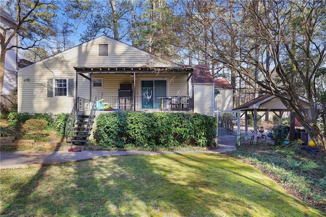 bungalow-style house featuring stairway, a porch, and a front yard