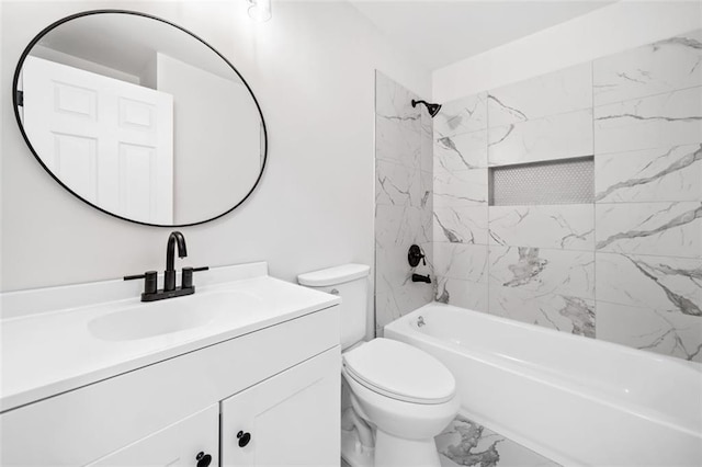 full bathroom featuring marble look tile flooring, toilet, vanity, and washtub / shower combination