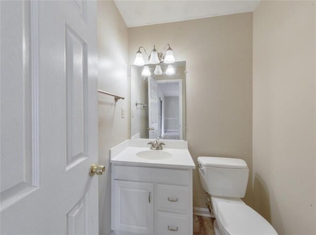 bathroom with vanity and toilet