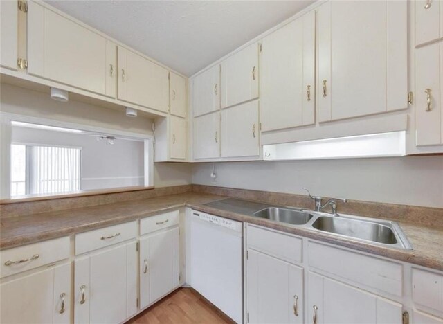 kitchen featuring light hardwood / wood-style flooring, white cabinets, dishwasher, and sink