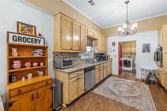 kitchen featuring washer / clothes dryer, visible vents, wall oven, a sink, and dishwasher