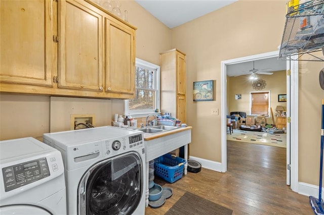 laundry room featuring dark wood finished floors, washer and clothes dryer, cabinet space, a ceiling fan, and baseboards