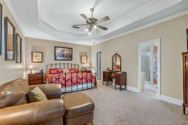 bedroom with a tray ceiling, light carpet, crown molding, and visible vents