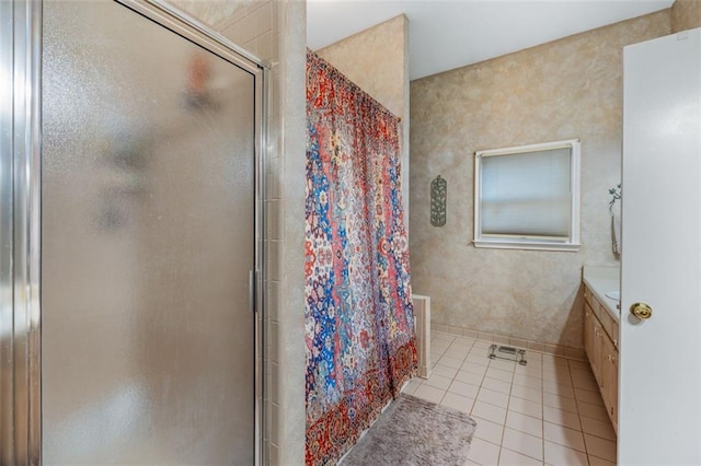 full bath featuring a shower stall, tile patterned flooring, and vanity