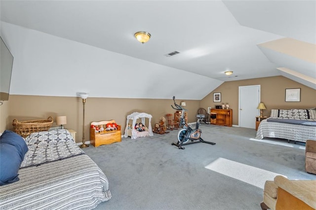 bedroom featuring lofted ceiling, carpet flooring, and visible vents