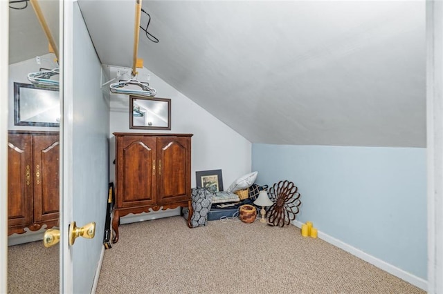 bonus room featuring vaulted ceiling, carpet flooring, and baseboards