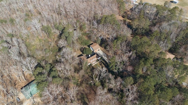 drone / aerial view featuring a forest view