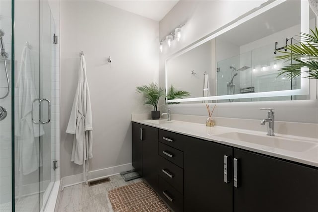 bathroom with vanity and walk in shower