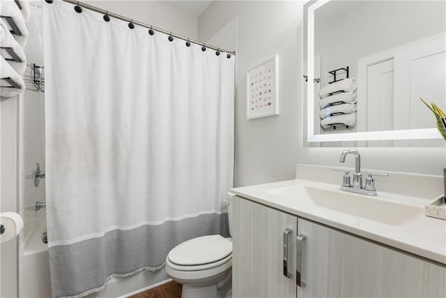 full bathroom featuring shower / tub combo, vanity, hardwood / wood-style flooring, and toilet