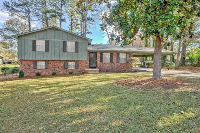 split level home with a front yard and a carport