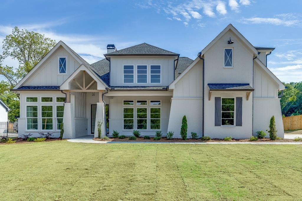 522 Hope Hollow Ln, Loganville, GA 30052 - rear view of property featuring a lawn