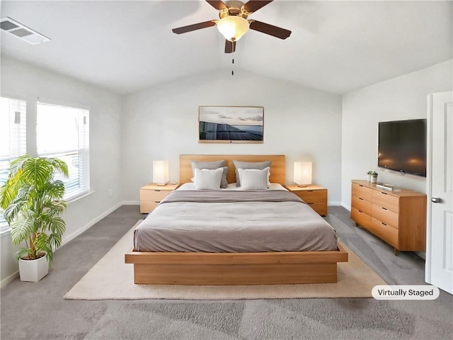 bedroom featuring ceiling fan, light carpet, and lofted ceiling