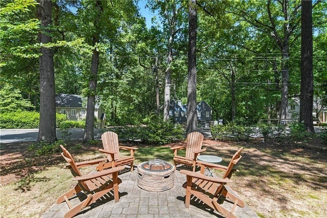 view of patio / terrace with an outdoor fire pit