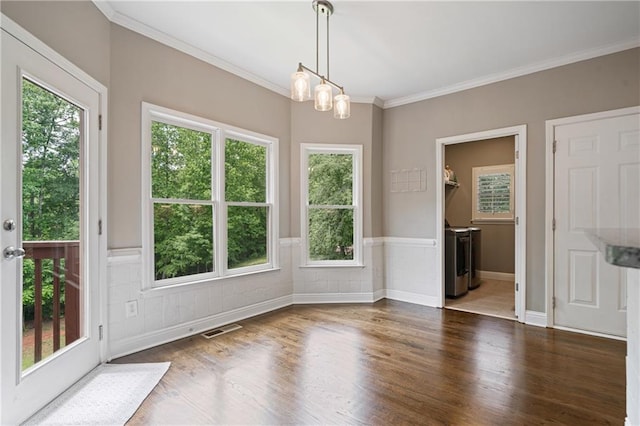 1758 Rosehedge Way NW, Kennesaw, GA 30152 - unfurnished dining area with dark wood-type flooring, ornamental molding, a chandelier, and a wainscoted wall