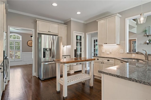 1758 Rosehedge Way NW, Kennesaw, GA 30152 - kitchen with appliances with stainless steel finishes, a sink, crown molding, dark stone countertops, and dark wood-type flooring