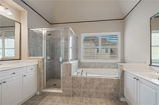 1758 Rosehedge Way NW, Kennesaw, GA 30152 - bathroom featuring vaulted ceiling, two vanities, a stall shower, a garden tub, and tile patterned floors