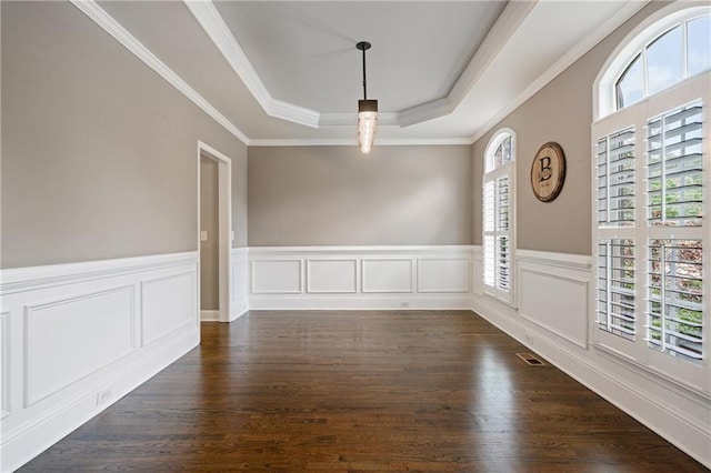 1758 Rosehedge Way NW, Kennesaw, GA 30152 - empty room with a raised ceiling, dark wood-style floors, a wainscoted wall, crown molding, and a decorative wall