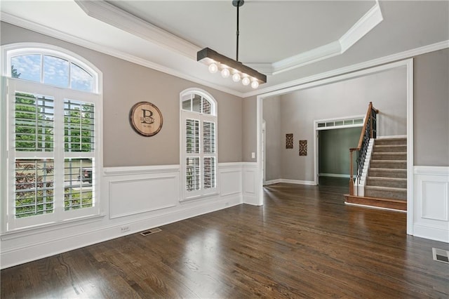 1758 Rosehedge Way NW, Kennesaw, GA 30152 - unfurnished dining area featuring ornamental molding, a wainscoted wall, a tray ceiling, stairway, and wood finished floors