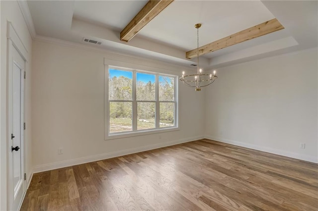 unfurnished room featuring beamed ceiling, a tray ceiling, wood-type flooring, crown molding, and an inviting chandelier