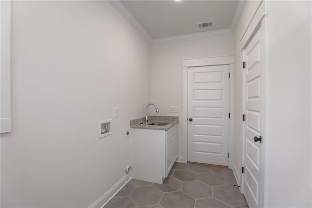 washroom featuring sink, hookup for an electric dryer, ornamental molding, washer hookup, and cabinets