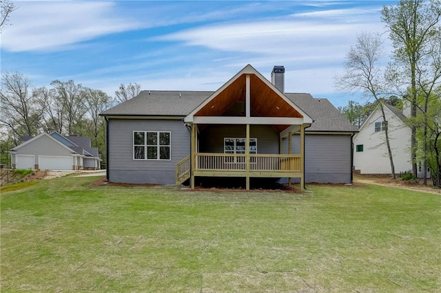 back of property featuring a porch and a yard