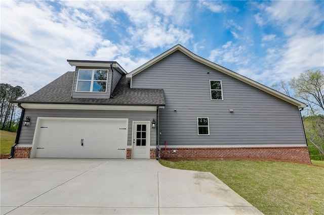 exterior space featuring a yard and a garage