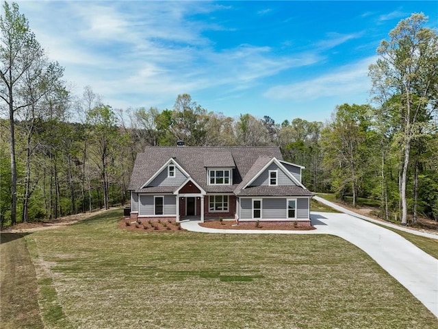 craftsman-style home with covered porch and a front yard