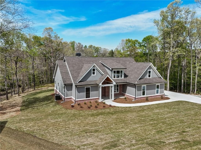 craftsman house with a front lawn and central AC unit