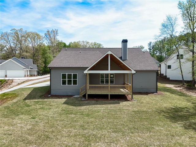 back of house with a yard and a porch