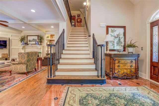 95 Weslyan Way, Oxford, GA 30054 - entrance foyer featuring stairs, crown molding, coffered ceiling, beam ceiling, and baseboards