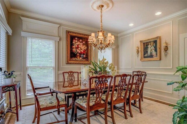 95 Weslyan Way, Oxford, GA 30054 - dining area with a decorative wall, a chandelier, crown molding, recessed lighting, and baseboards