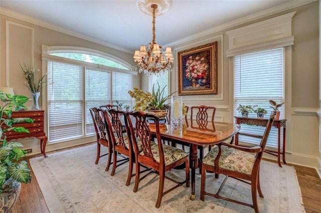 95 Weslyan Way, Oxford, GA 30054 - dining space featuring a chandelier, ornamental molding, and light wood-style floors