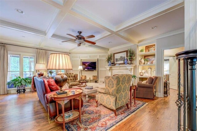 95 Weslyan Way, Oxford, GA 30054 - living area with wood finished floors, beam ceiling, coffered ceiling, ceiling fan, and crown molding