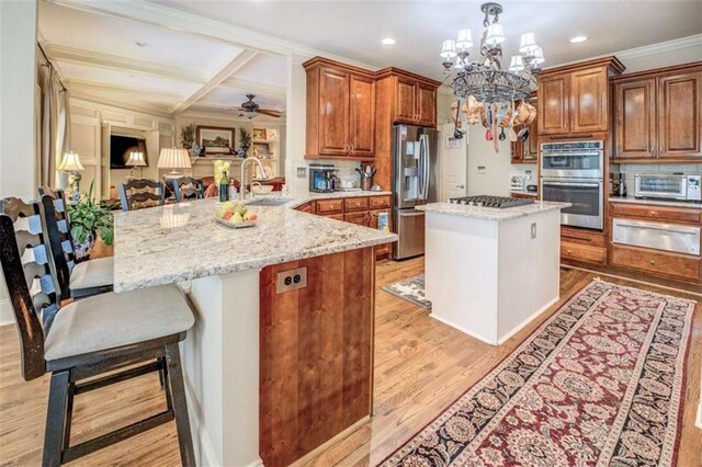 95 Weslyan Way, Oxford, GA 30054 - kitchen with stainless steel appliances, a warming drawer, a sink, light stone countertops, and recessed lighting