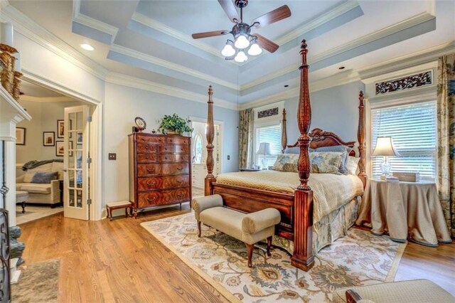 95 Weslyan Way, Oxford, GA 30054 - bedroom with a raised ceiling, ornamental molding, wood finished floors, baseboards, and a ceiling fan