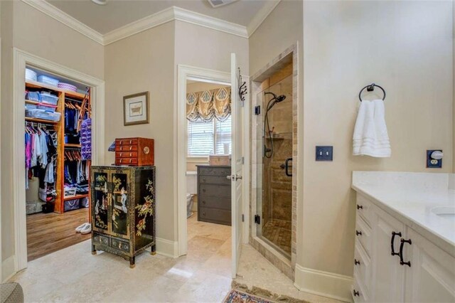 95 Weslyan Way, Oxford, GA 30054 - bathroom with a stall shower, crown molding, baseboards, vanity, and a walk in closet