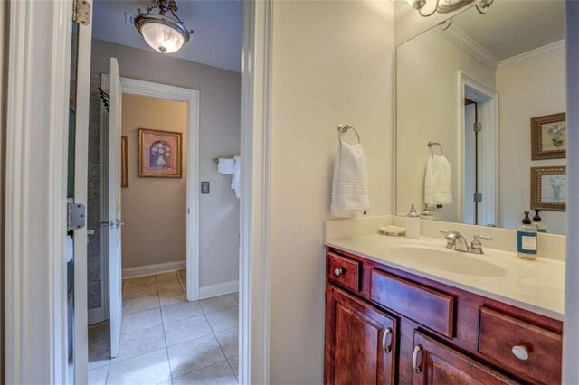 95 Weslyan Way, Oxford, GA 30054 - bathroom featuring vanity, crown molding, tile patterned floors, and baseboards