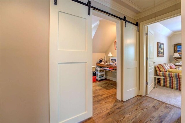 95 Weslyan Way, Oxford, GA 30054 - hallway featuring ornamental molding, wood finished floors, and a barn door
