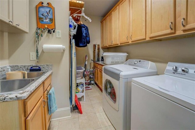 95 Weslyan Way, Oxford, GA 30054 - washroom featuring washer and dryer, cabinet space, light tile patterned flooring, and baseboards