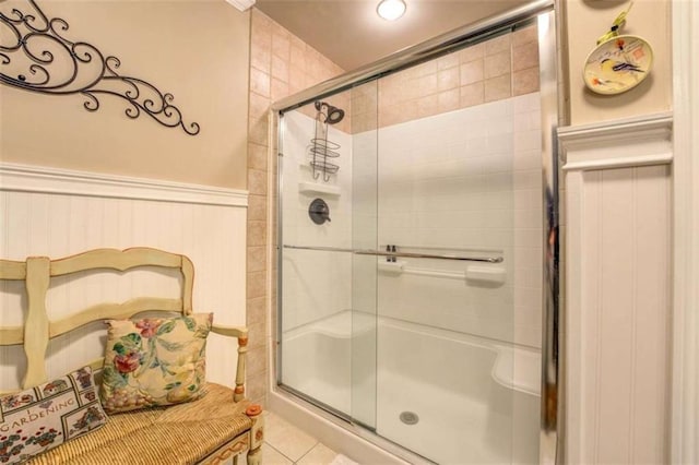 95 Weslyan Way, Oxford, GA 30054 - full bath featuring a stall shower, a wainscoted wall, and tile patterned floors