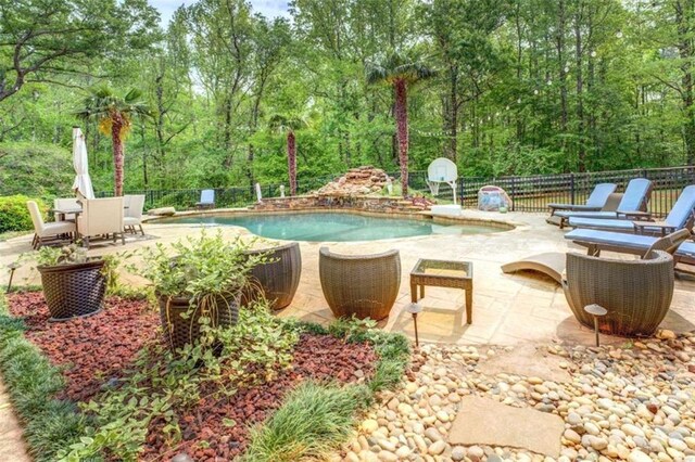 95 Weslyan Way, Oxford, GA 30054 - view of swimming pool featuring a fenced backyard, a patio, and view of scattered trees