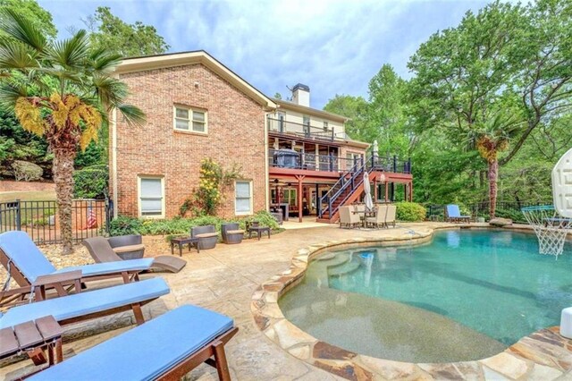 95 Weslyan Way, Oxford, GA 30054 - outdoor pool with stairway, a patio area, and a wooden deck