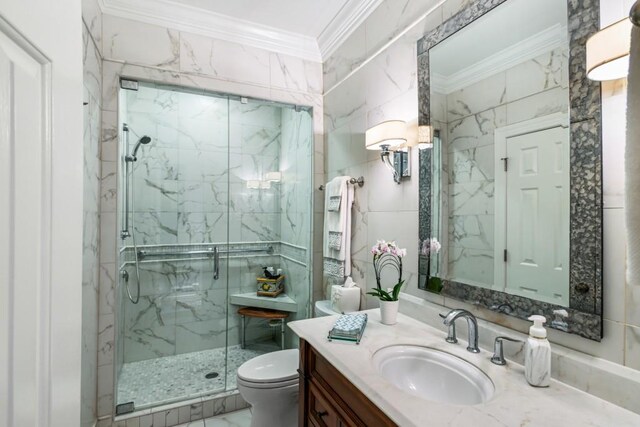 bathroom featuring vanity, ornamental molding, toilet, tile walls, and a marble finish shower