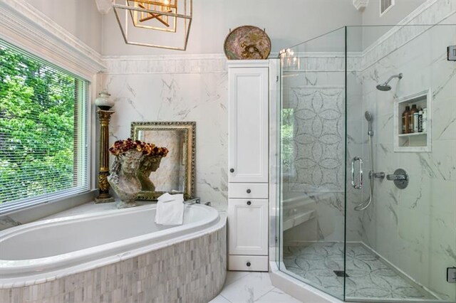 full bath with a marble finish shower, a garden tub, ensuite bath, and visible vents